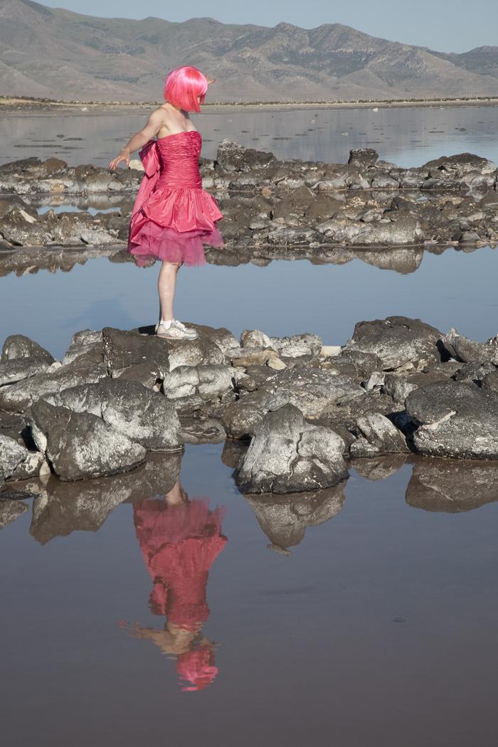 "(A still from) a dizzying hot pink prom dress whirling at Spiral Jetty, 2009